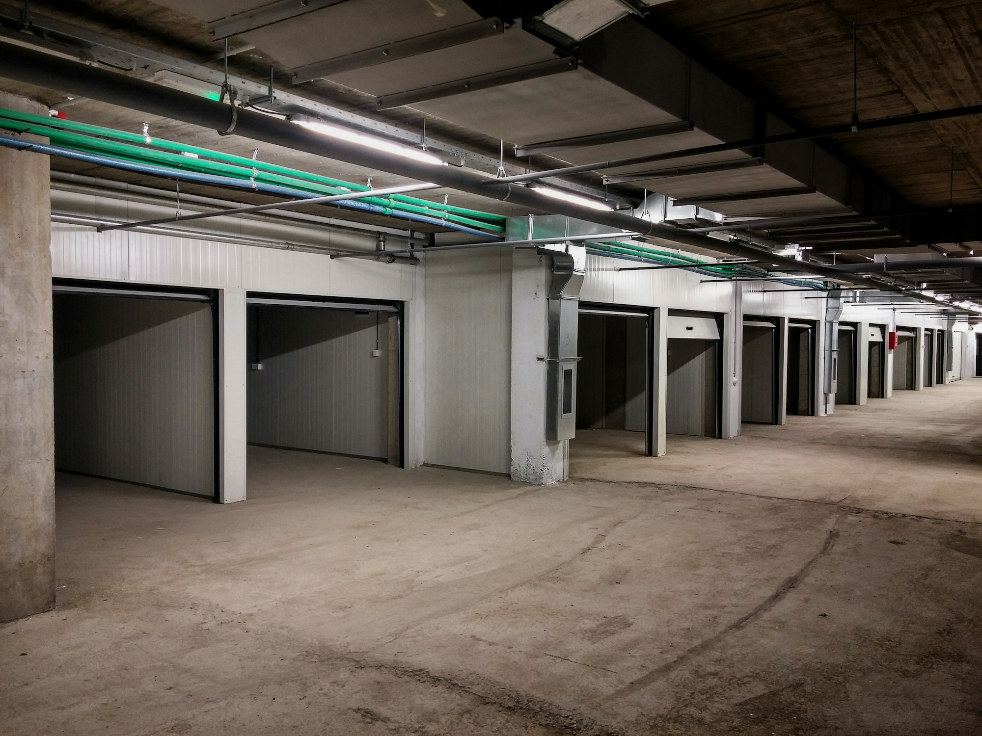 Garage building made of concrete with roller shutter doors